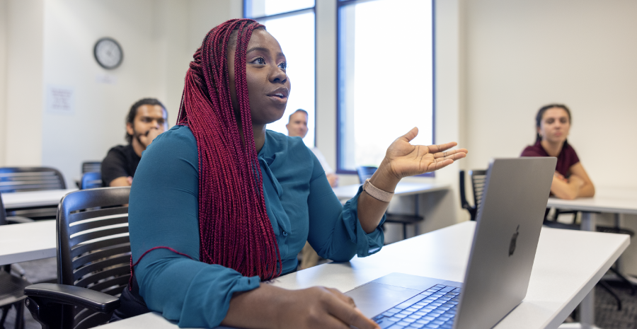 Student speaking to professor