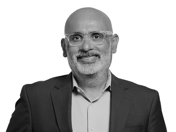 a black and white headshot photo of the Dean, Sukhwant Jhaj