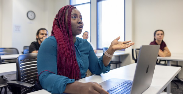 Student speaking to professor